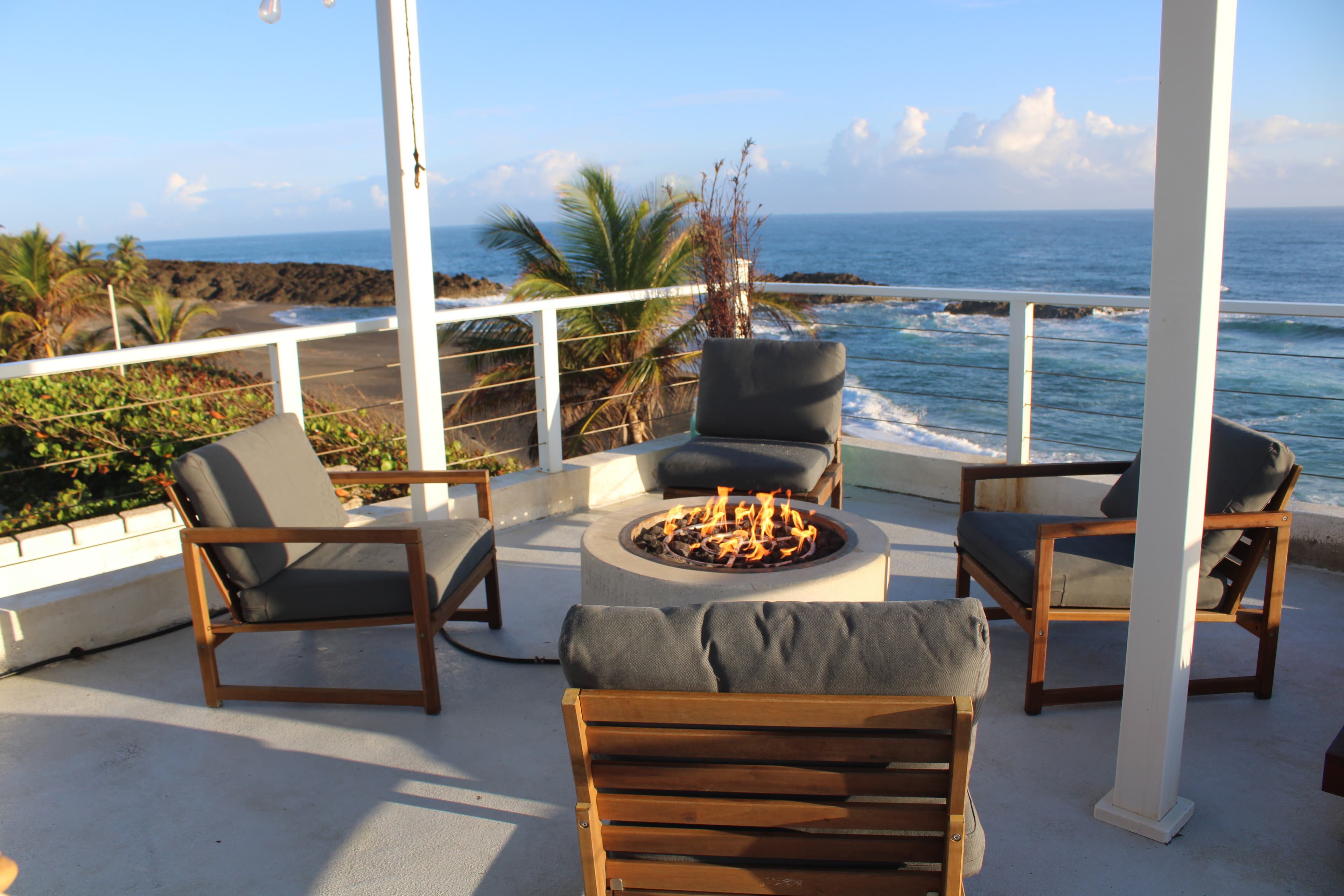 Fire pit at sunset with ocean views — perfect for celebrations at Arenas Negra