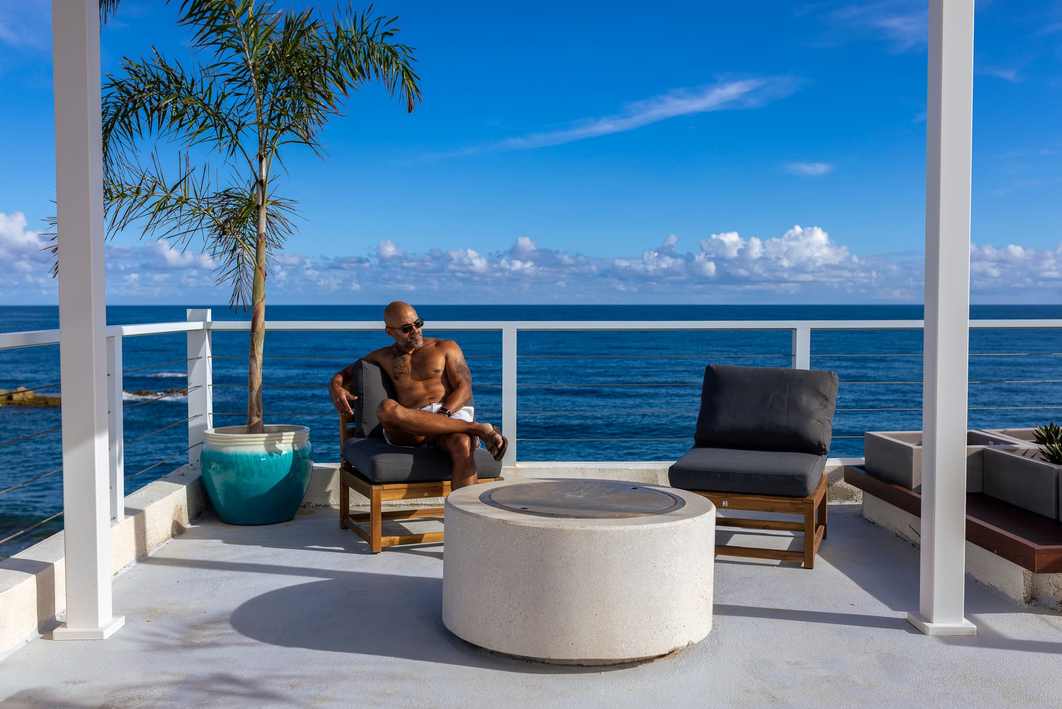 Lounging on the rooftop pergola at sunset
