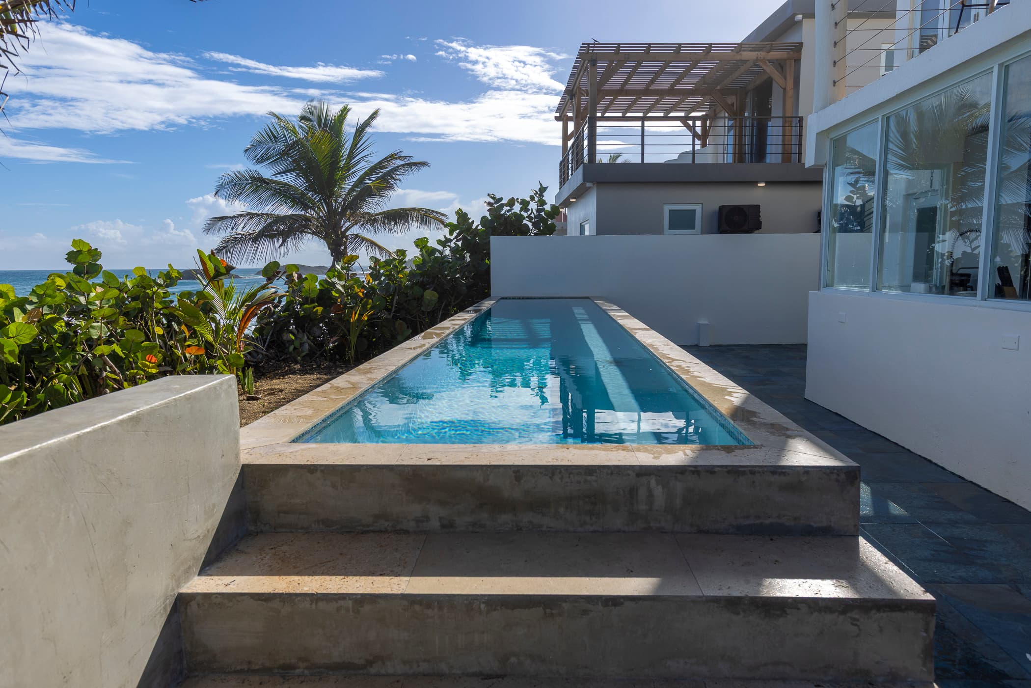 Infinity lap pool facing the ocean at Arenas Negra