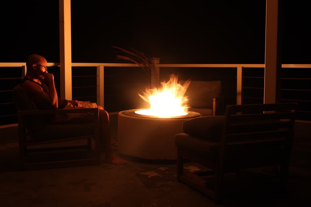 Ramon beside the rooftop fire pit